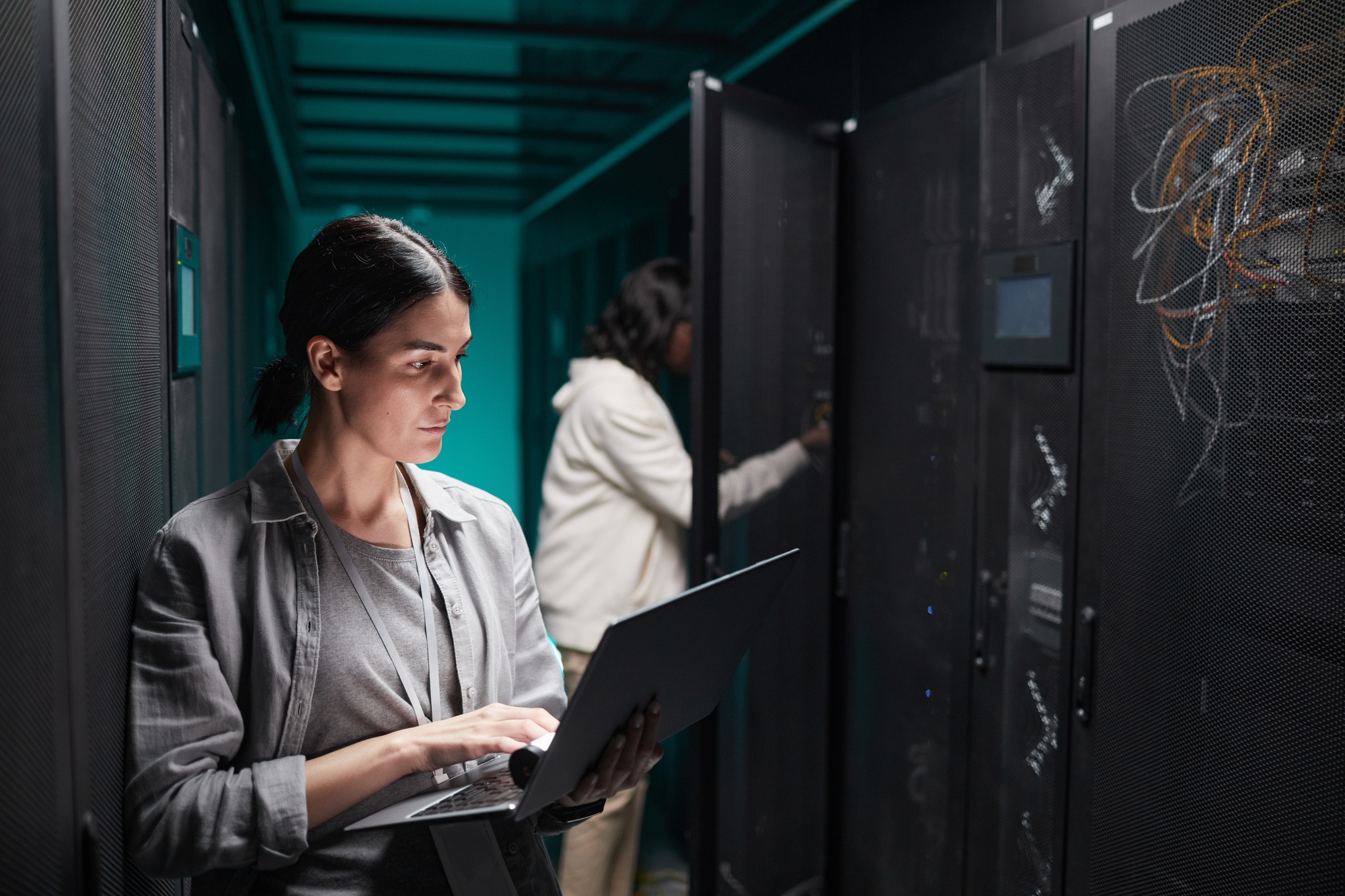 Two Women Working in Data Center